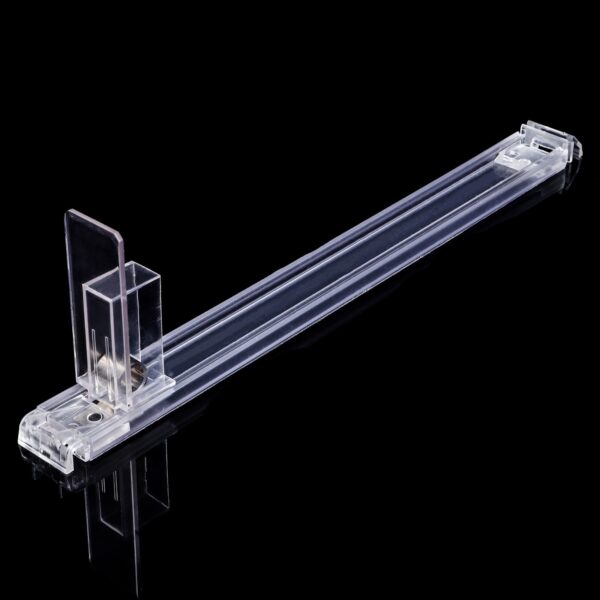 clear product pusher for shops displays on a black background.