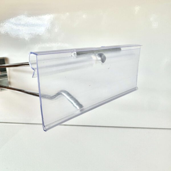 clear plastic price ticket holder attached to retail display hook for flip tickets
